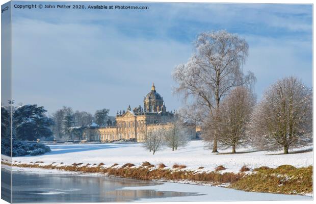 Castle Howard and South Lake in mid-winter. Canvas Print by John Potter