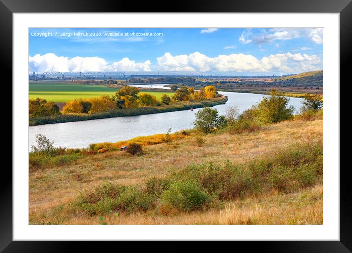 A beautiful autumn landscape with a smooth bend of the river among the plain of fields. Framed Mounted Print by Sergii Petruk