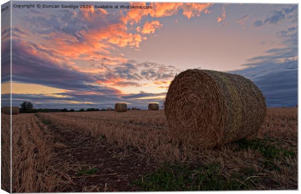Harvest / hay bale sunset Canvas Print by Duncan Savidge