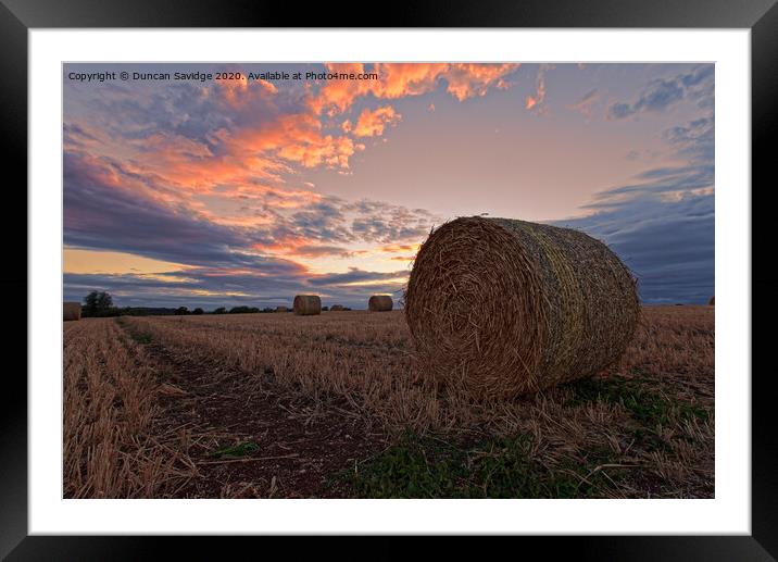 Harvest / hay bale sunset Framed Mounted Print by Duncan Savidge