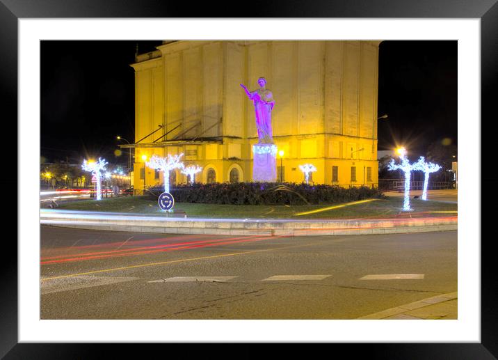 Lights in the evening near a sculpture Framed Mounted Print by Jose Manuel Espigares Garc