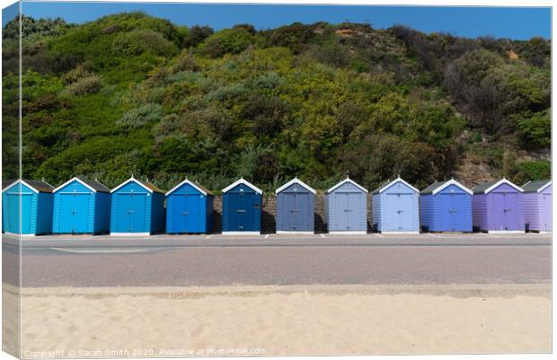 Row of beach huts at Bournemouth  Canvas Print by Sarah Smith