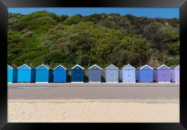 Row of beach huts at Bournemouth  Framed Print by Sarah Smith