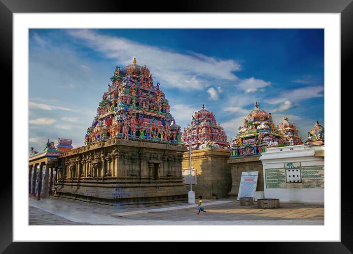 Chennai, India - October 27, 2018: Interior of Arulmigu Kapaleeswarar Temple an ancient Hindu architecture temple located in South India. A little Indian girl running inside a hindu temple Framed Mounted Print by Arpan Bhatia