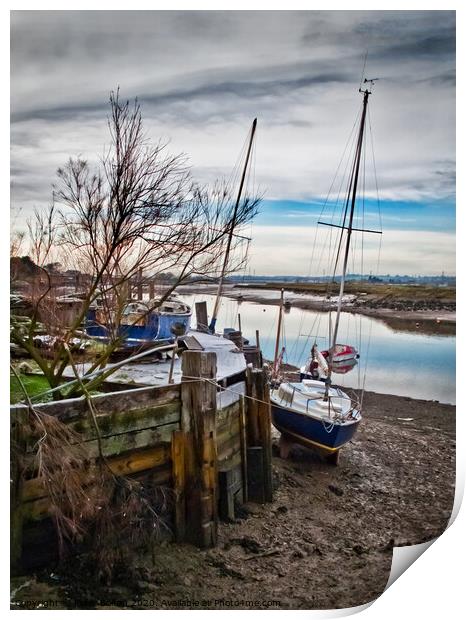A mooring dock on the River Crouch with boats waiting for the tide. Hullbridge, Essex, UK. Print by Peter Bolton