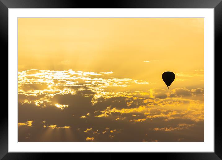 hot air balloon in the sky with orange sunrise clouds Framed Mounted Print by David Galindo
