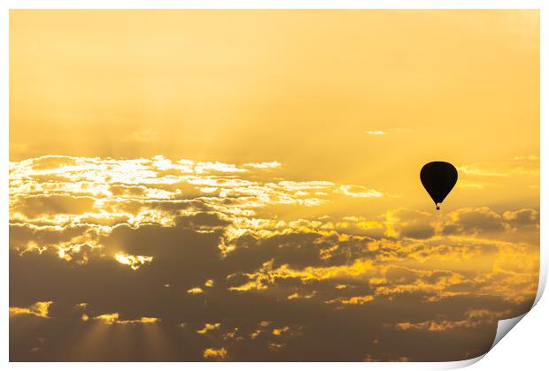 hot air balloon in the sky with orange sunrise clouds Print by David Galindo