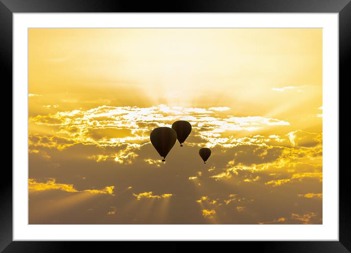 some hot air balloons in the sky with orange sunrise clouds Framed Mounted Print by David Galindo
