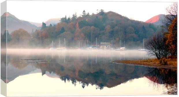 Yachts in the mist at Derwent Water in Cumbria. Canvas Print by john hill