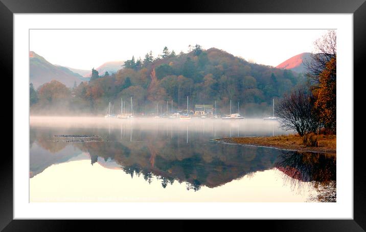 Yachts in the mist at Derwent Water in Cumbria. Framed Mounted Print by john hill