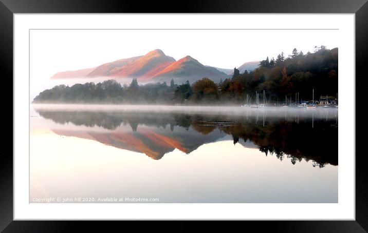 Morning reflections on Derwent water in Cumbria. Framed Mounted Print by john hill