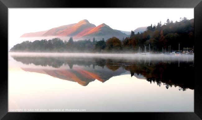 Morning reflections on Derwent water in Cumbria. Framed Print by john hill