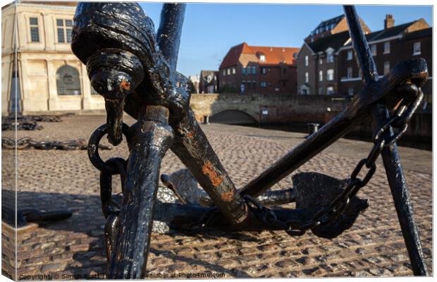 Quay side anchor and chains in Norfolk Canvas Print by Simon Bratt LRPS