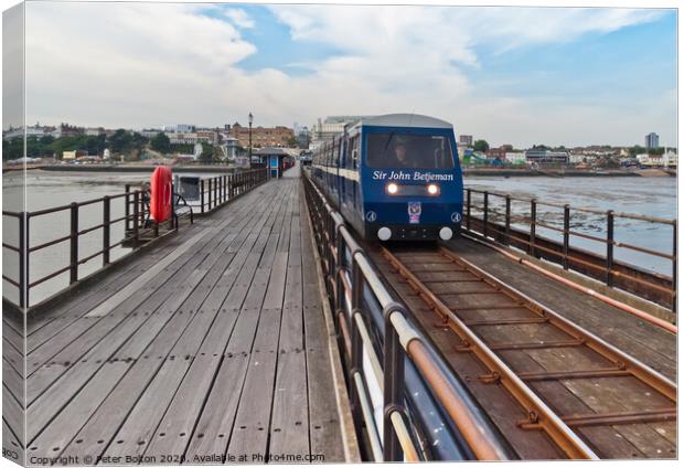 A train makes it way along the pier at Southend on Sea, Essex, UK Canvas Print by Peter Bolton