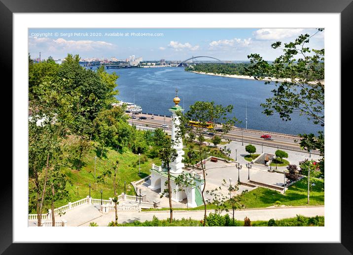 Beautiful landscape of summer Kyiv with a view of the Dnipro River and a monument to the Magdeburg Law. Framed Mounted Print by Sergii Petruk