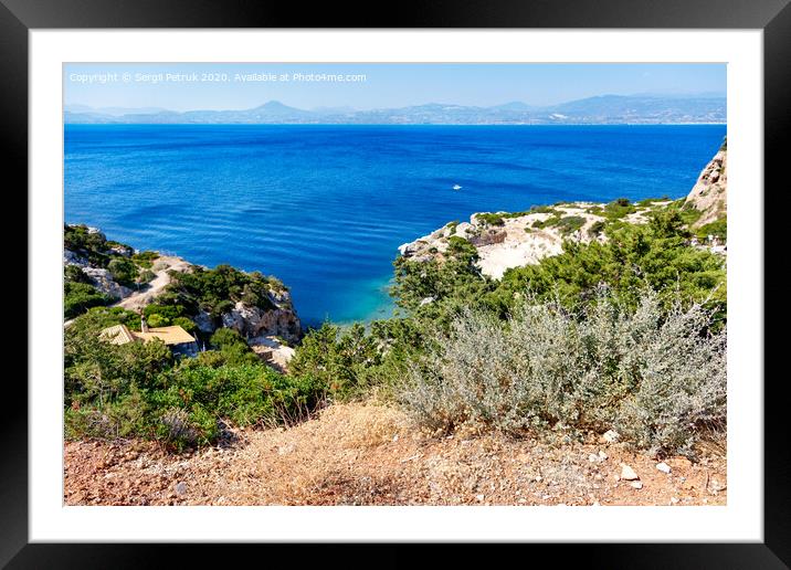 A hard, thorny shrub grows on the slope of the Gulf of Corinth against the backdrop of a blue lagoon on the coast. Framed Mounted Print by Sergii Petruk