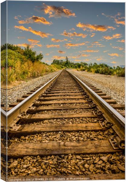Straight Railroad Tracks at Dusk Canvas Print by Darryl Brooks