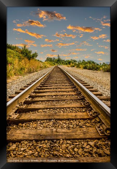 Straight Railroad Tracks at Dusk Framed Print by Darryl Brooks