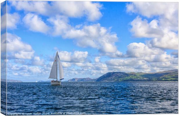 Yacht sailing in the Menai Straits Canvas Print by Kevin Hellon