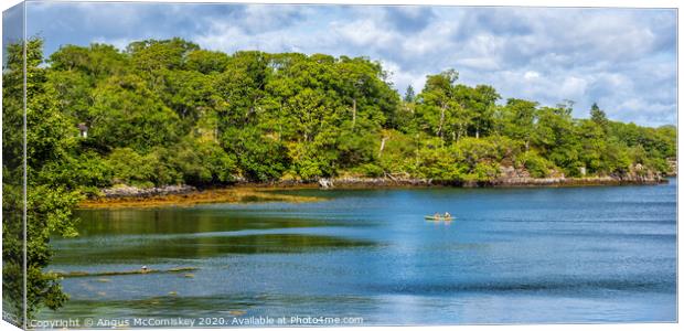 Canoe crossing sheltered bay in Loch Gairloch Canvas Print by Angus McComiskey