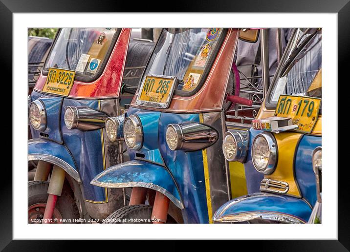 Tuk tuks lined up in Bangkok  Framed Mounted Print by Kevin Hellon