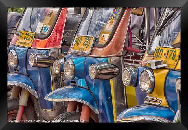 Tuk tuks lined up in Bangkok  Framed Print by Kevin Hellon