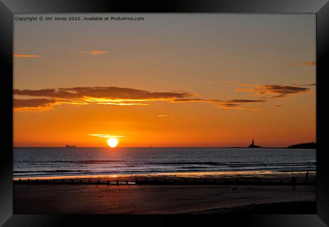 Sunrise over a tranquil North Sea Framed Print by Jim Jones