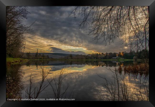 Cloud reflection in a lake with sunset Framed Print by Marketa Zvelebil