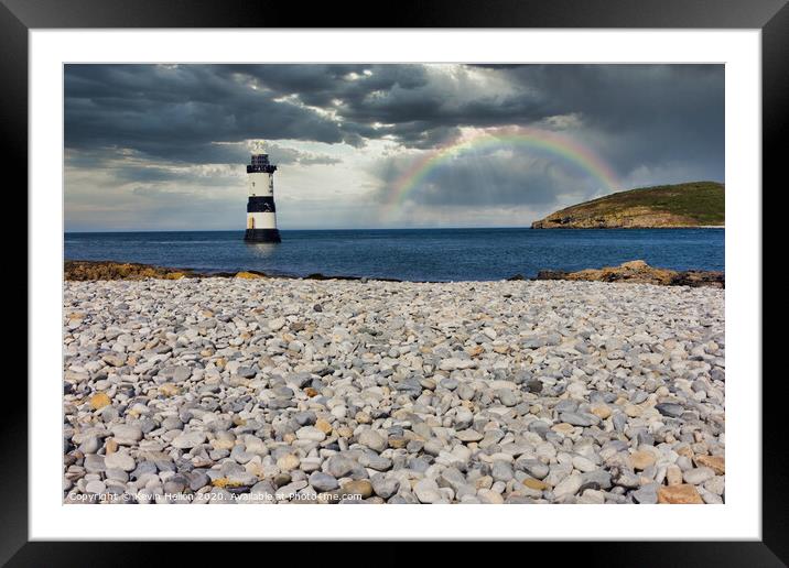 Penmon lighthouse and shingle beach with rainbow Framed Mounted Print by Kevin Hellon