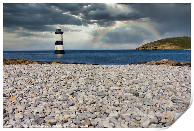Penmon lighthouse and shingle beach with rainbow Print by Kevin Hellon