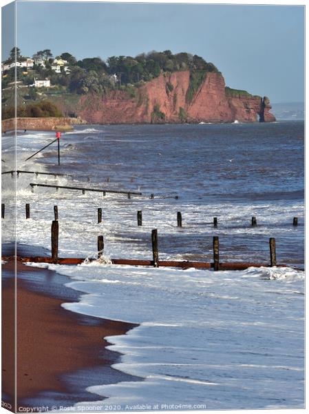Groynes and waves on Teignmouth Beach in South Devon Canvas Print by Rosie Spooner