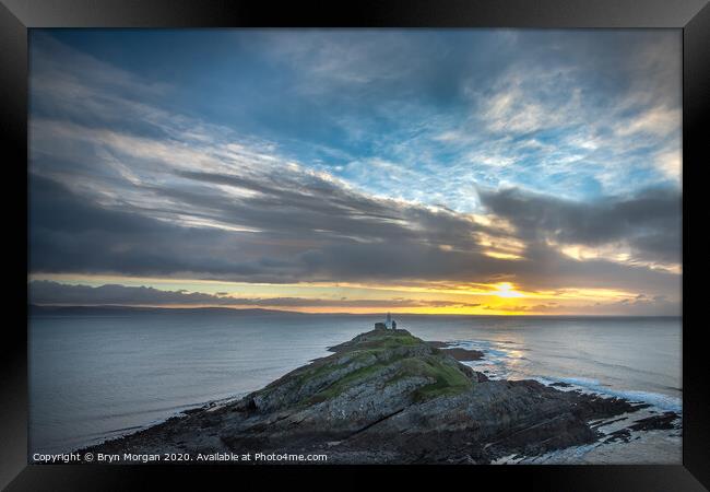 Mumbles lighthouse viewed from the hill above the bay Framed Print by Bryn Morgan