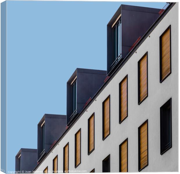 Low angle view of modern apartment building Canvas Print by Juan Jimenez
