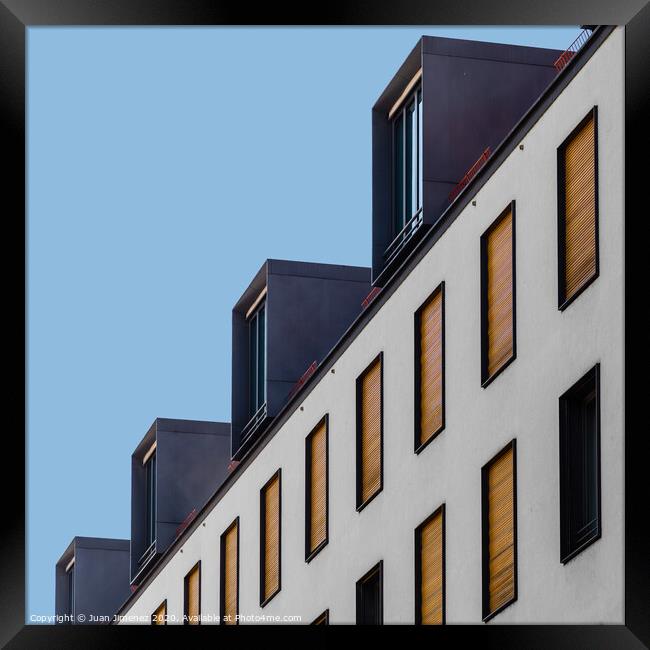 Low angle view of modern apartment building Framed Print by Juan Jimenez