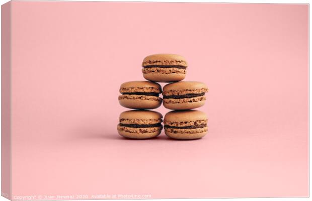 Macaroons isolated on pink background  Canvas Print by Juan Jimenez
