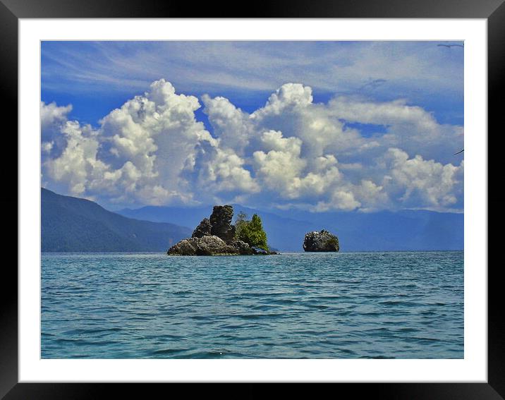 clouds and coral islands Framed Mounted Print by John Lusikooy