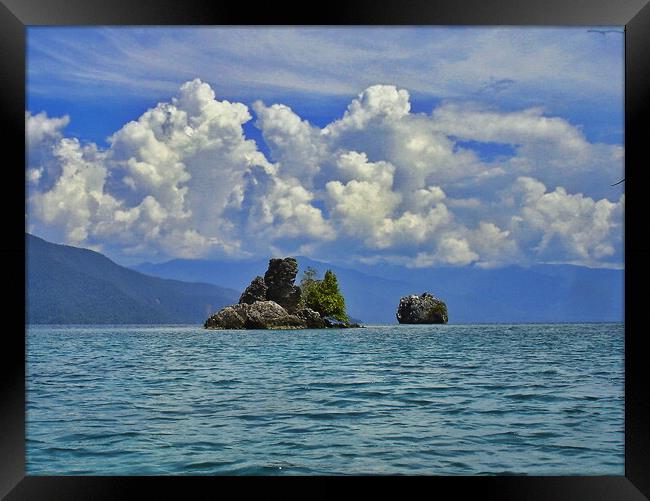 clouds and coral islands Framed Print by John Lusikooy