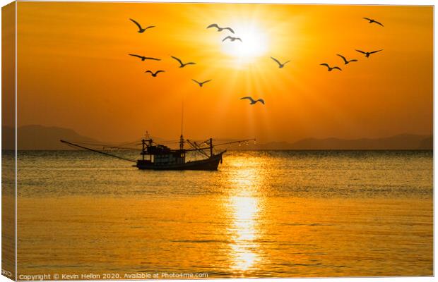 Fishing boat at sunset Canvas Print by Kevin Hellon