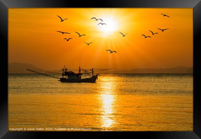 Fishing boat at sunset Framed Print by Kevin Hellon
