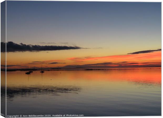 Three Boats in Sunset over Lagune de Thau Canvas Print by Ann Biddlecombe