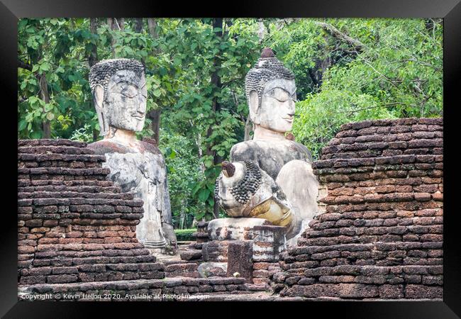 Buddha statues  Framed Print by Kevin Hellon