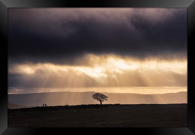 Sunbeams and Silhouetts, Peak District.  Framed Print by John Finney