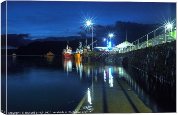 Fishing boats moored to the end of the pier at the blue hour. Canvas Print by Richard Smith
