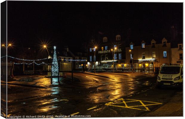 Somerled Square, Portree with Christmas tree and lights reflected on wet pavement Canvas Print by Richard Smith