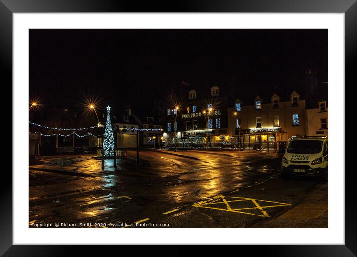 Somerled Square, Portree with Christmas tree and lights reflected on wet pavement Framed Mounted Print by Richard Smith
