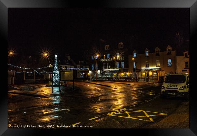 Somerled Square, Portree with Christmas tree and lights reflected on wet pavement Framed Print by Richard Smith