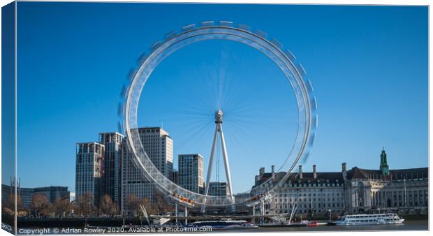 The London Eye in motion Canvas Print by Adrian Rowley