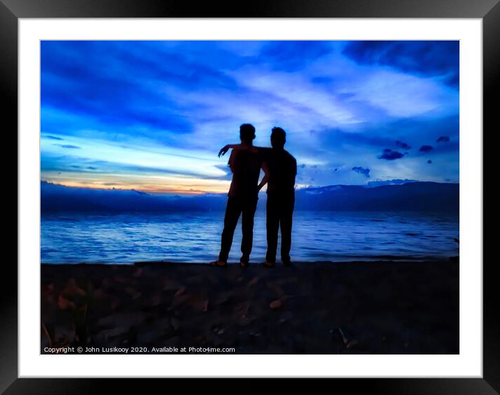 silhouette of friendship Framed Mounted Print by John Lusikooy