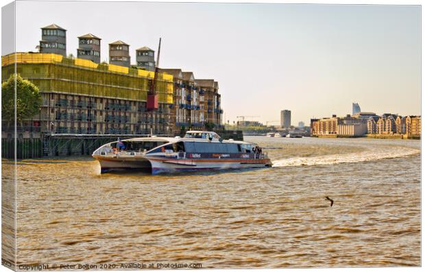 A Clipper Ferry on The River Thames, London. Canvas Print by Peter Bolton
