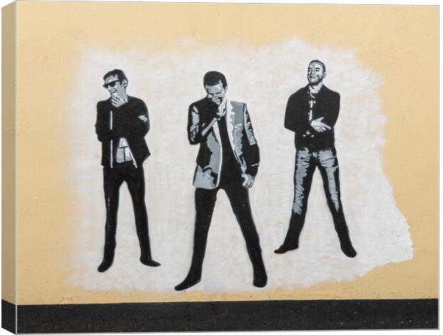Wall painting of the pop group Muse  Canvas Print by Steve Heap
